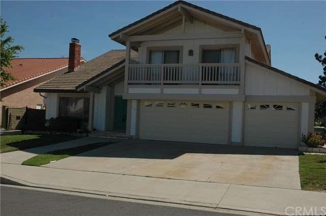 Front elevation and three car garage with balcony 