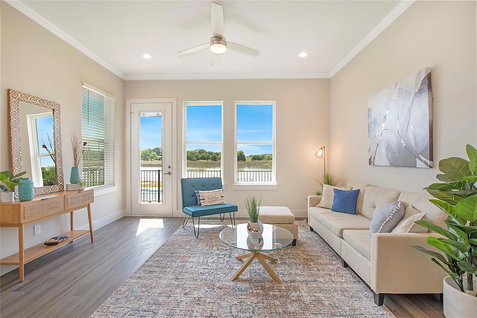 Living area with wood finished floors, a ceiling f