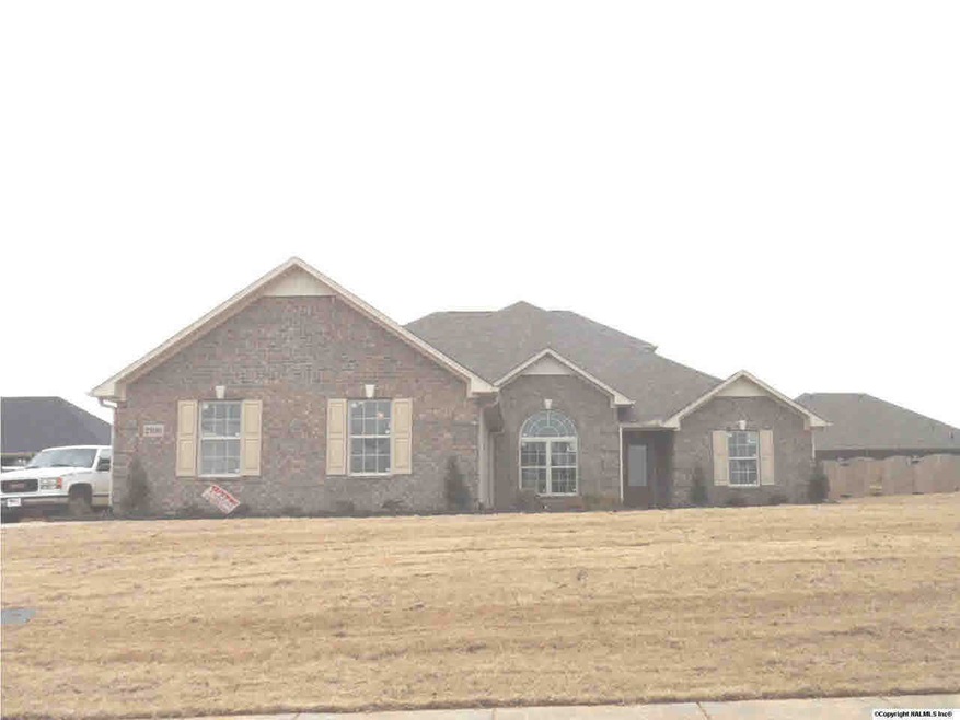 Waterford Plan B - Brick home with 3 car garage and bonus / bed / bath upstairs.