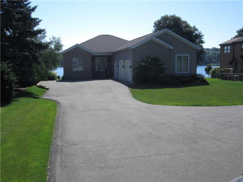 Exterior Front. Lakefront living made easy in this