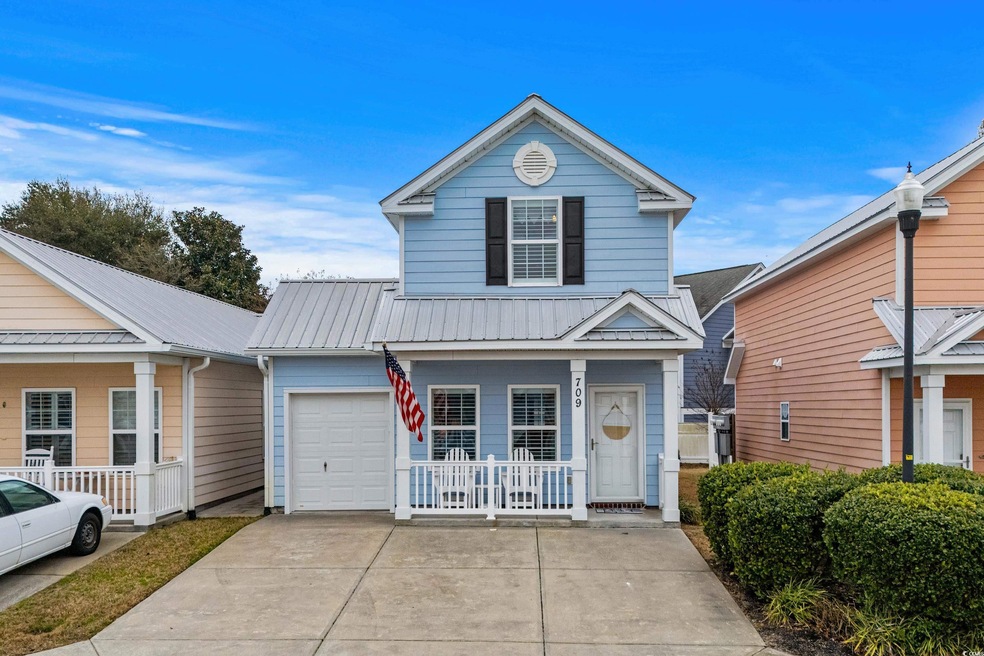 Front facade with a garage and covered porch