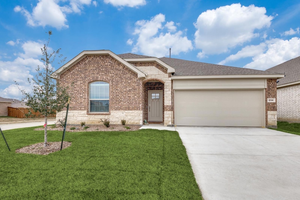 Ranch-style house featuring brick siding, roof wit
