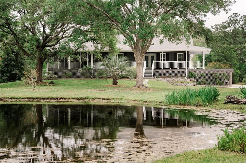 Nicely landscaped with a large pond in front to wa