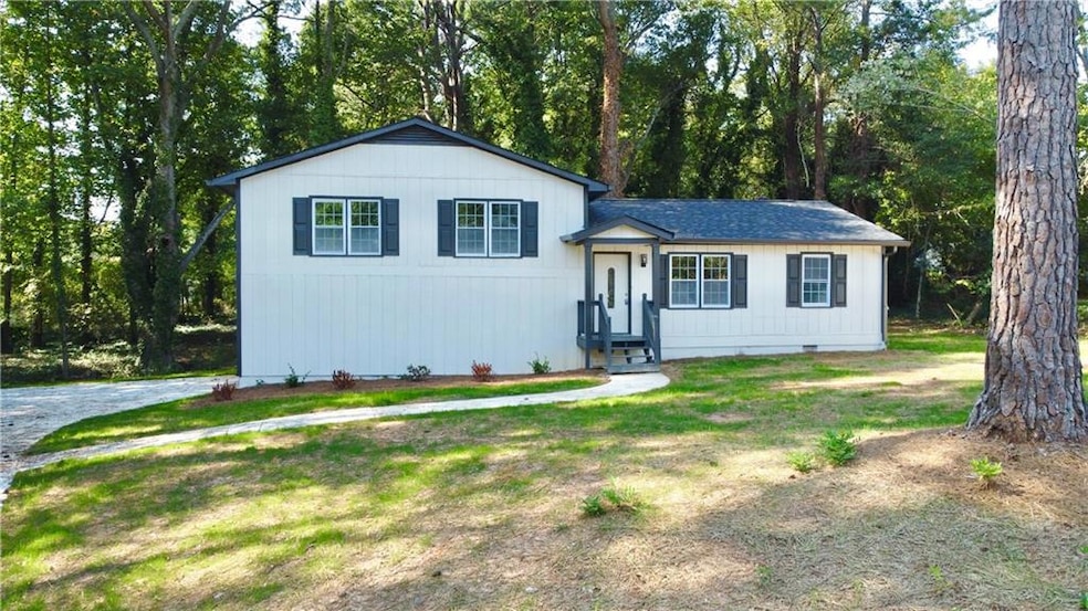 Split level home with a front yard