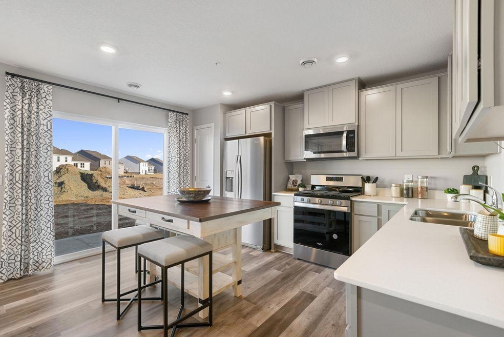 Welcome to the Finley! DR Horton's newest 3-bedroom townhome features an open concept main level kitchen space. Photo of model, colors and finishes may vary.
