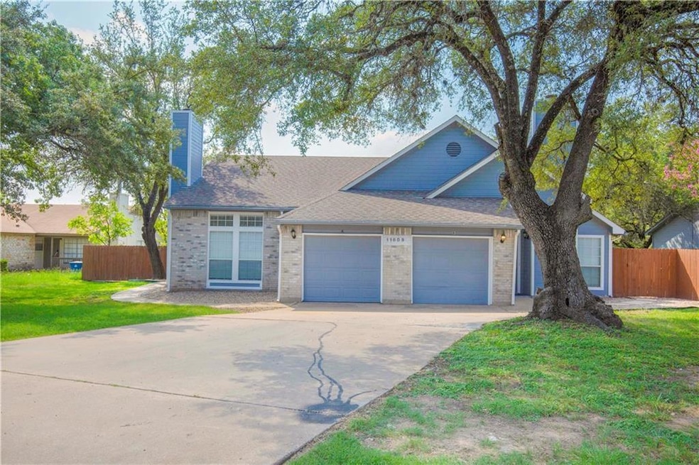 Ranch-style home with fence, concrete driveway, b