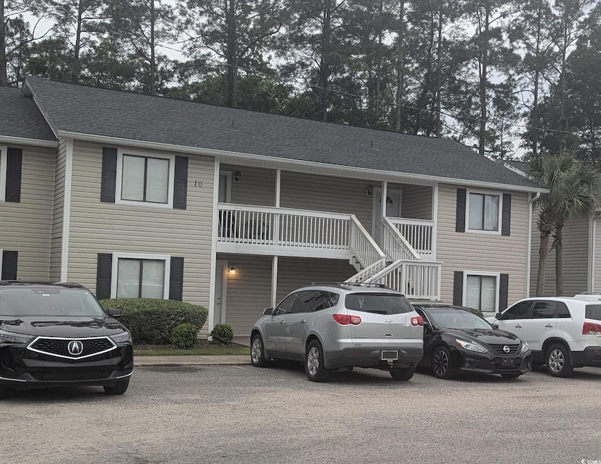 Multi unit property with stairs and roof with shingles