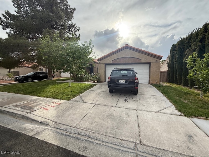 View of front of house with concrete driveway, a f