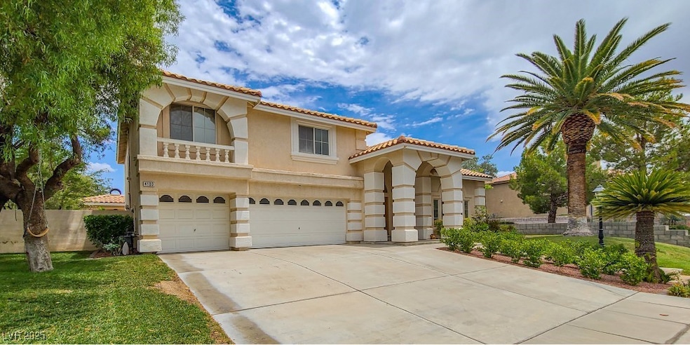 Mediterranean / spanish-style home featuring stucco siding, an attached garage, driveway, a tile roof, and a balcony