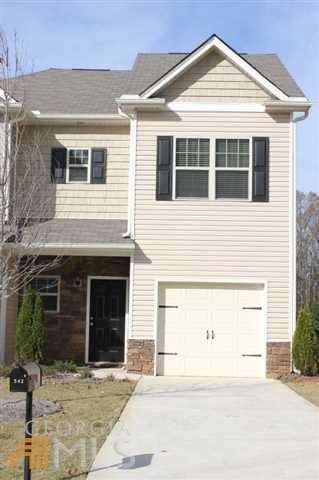 Meticulously maintained end unit townhome with upg