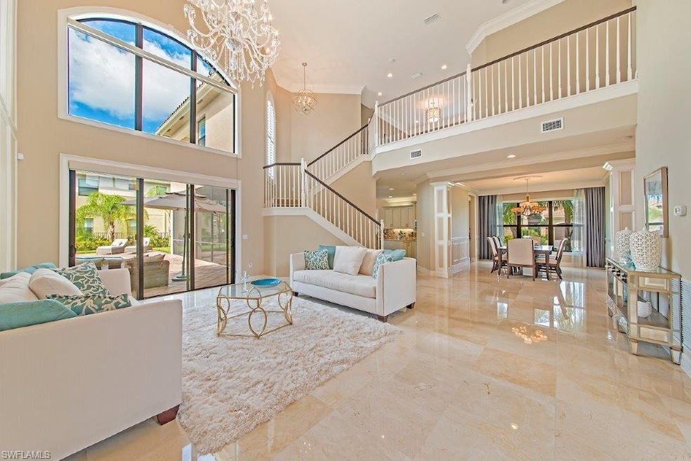 Formal living and dining room with designer lighti