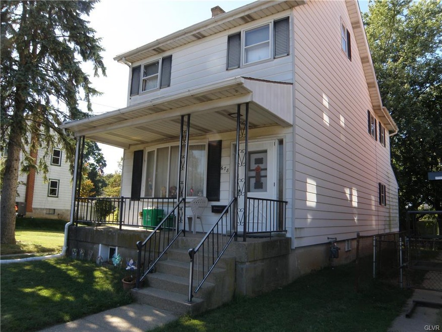 Front of house with covered porch.