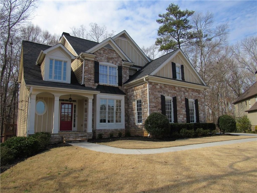 STONE AND HARDIPLANK HOME SITS BEAUTIFULLY ON 1/2 