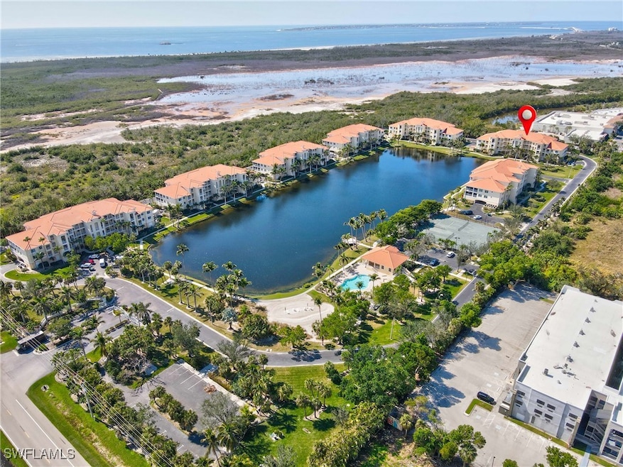Bird's eye view with a water view and a view of th
