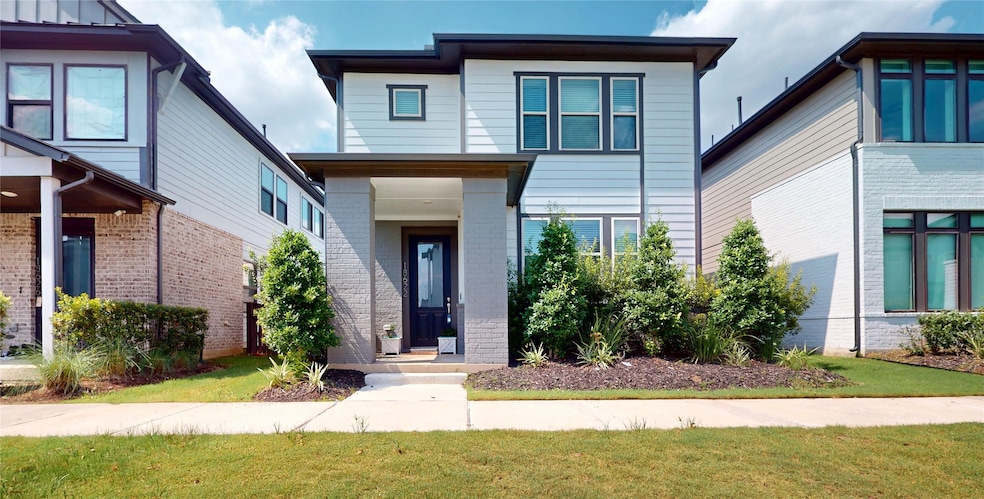 Modern two-story home with sleek lines and a welco
