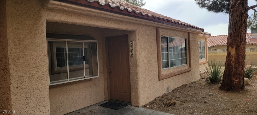 View of exterior entry featuring stucco siding and