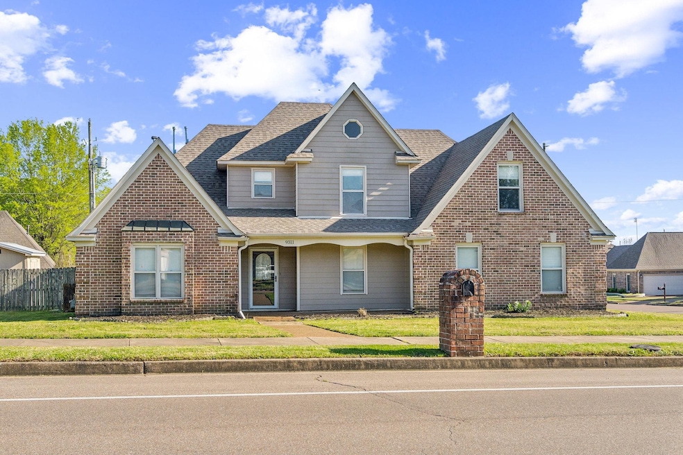 Traditional-style house with brick siding, a front