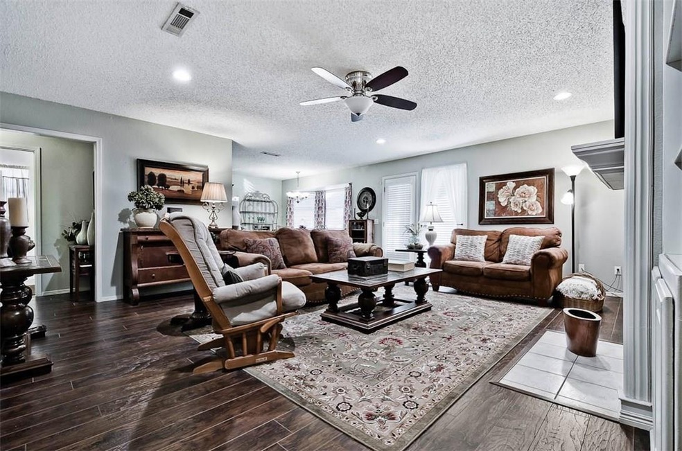 Living Room with new floors, opens to the eat-in-k