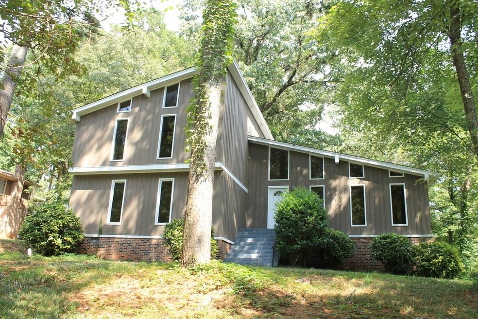 STUNNING CONTEMPORARY ON  ACRE CORNER LOT. FEATURE