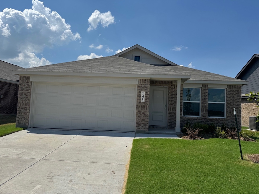 Single story home featuring brick siding, concrete driveway, a front lawn, and a garage
