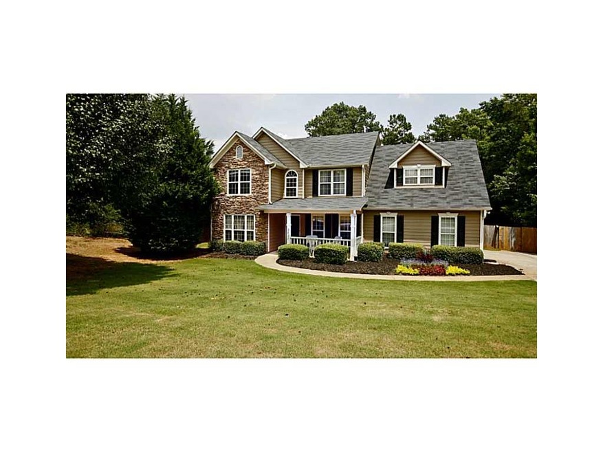 Exterior Front. Fabulous curb appeal and a side en