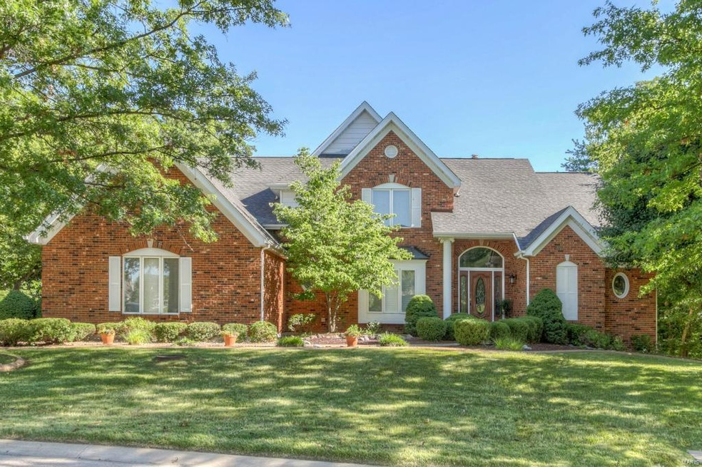 Custom built 1.5 story home on 1+ acre lot backing