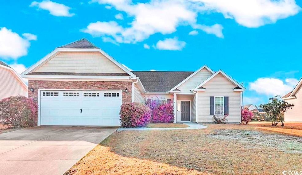 View of front of house featuring a front lawn, con