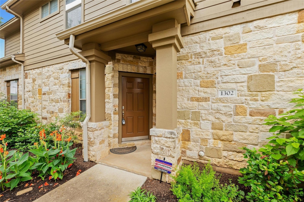 View of exterior entry with stone siding