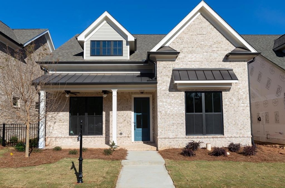 Sweet little rocking chairs are begging to be placed here on your covered patio. - Photos shown are of previously finished home. This homesite is currently under construction.
