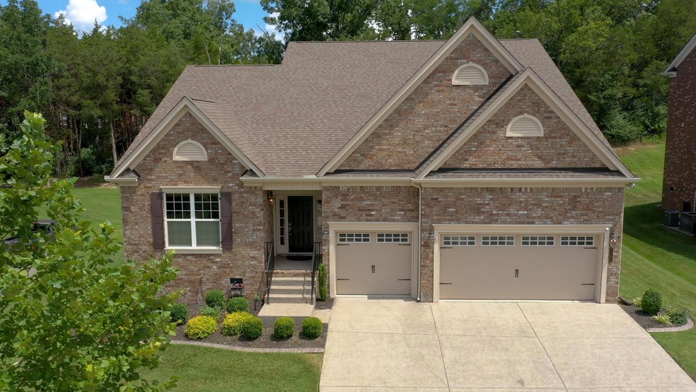 Your 5 bedroom 3 car garage wrapped in  4 sides of brick