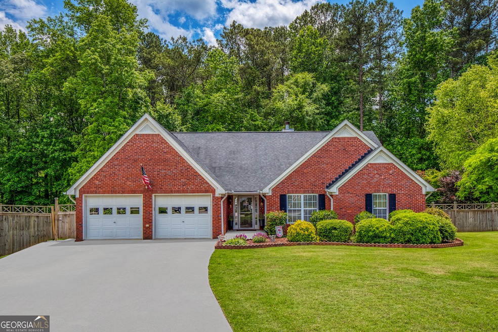 Front of Home with touch up to driveway