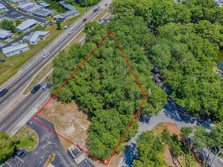 Aerial view of the 0.59-acre subject property, prominently situated along the heavily traveled, four-lane divided highway—State Road 19 South.
