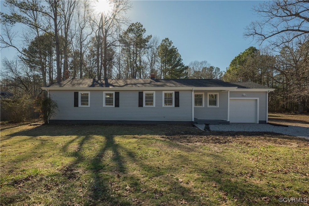 View of front of property with driveway, a chimney