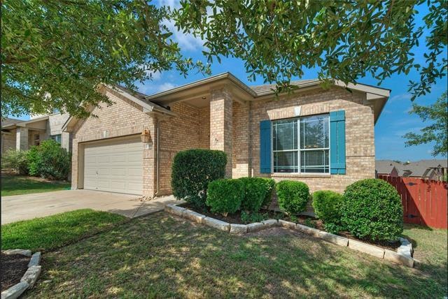 Delightful shaded front yard with mature landscaping