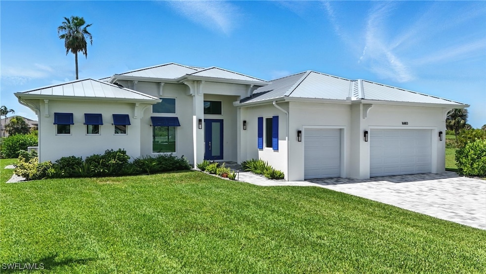 View of front facade featuring a garage, stucco si
