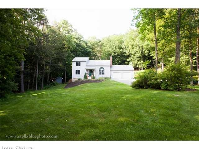 Exterior Front. Contemporary nestled privately on 