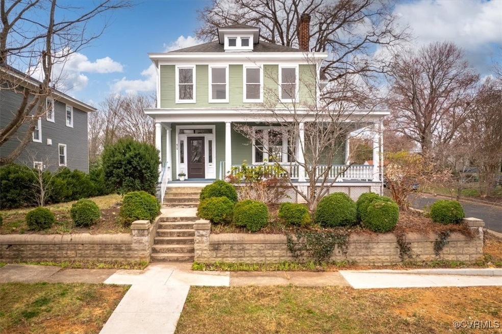 Traditional style home with a porch and a chimney
