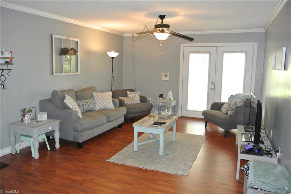 LIVING ROOM/BUILT IN BIND ON DOORS LEADING TO BALCONY