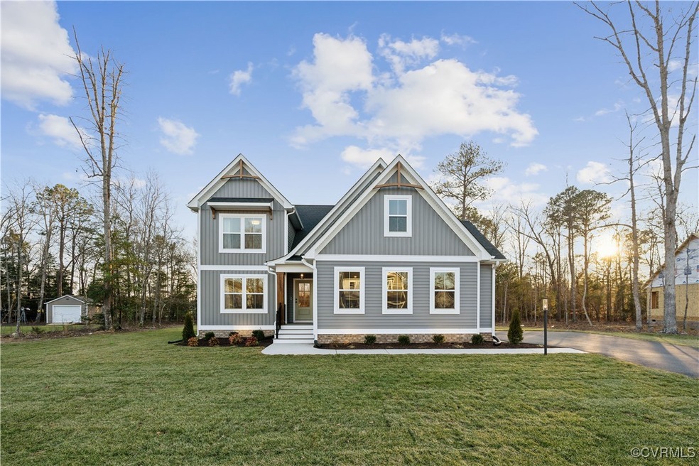 Craftsman house featuring a front yard, board and