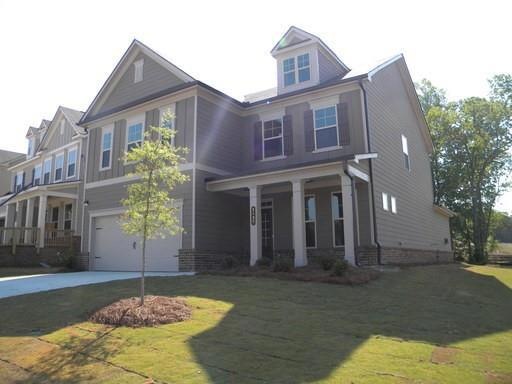 View of front of property featuring a garage, a fr