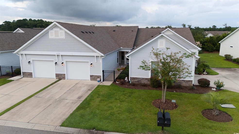 Ranch-style house with a garage and a front yard