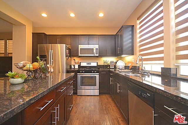 , Open kitchen with a big island counter & granite