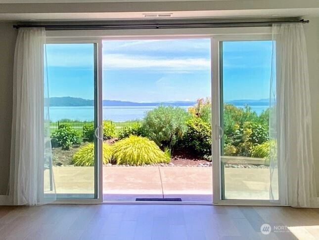 24K PRICE REDUCTION!  RARE Opportunity for WATERFRONT living on the Puget Sound at Point Ruston. Seller's considering all offers, so come take a look at this beauty this Sunday.  Open House 6/22 from 12-3.   Lovely 1050 Sq.' Corner, garden unit just a few grassy steps from the waters of Puget Sound.  Open concept/lots of light. High quality materials throughout. Brazilian Oak hardwoods.  Large temp-controlled storage room across the hall.  Spacious 700Sq' wrap around patio for relaxing and gardening.  Two 5th floor lounges offer stunning views. Active lifestyle heaven. Kayak/bicycle storage on site! So many amenities at your fingertips...restaurants, pubs, fitness center, shops, theater, urgent care, public market, outdoor concerts, water park & so much more.  Easy freeway access too!  In the heart of Point Ruston...The place where all the fun is!