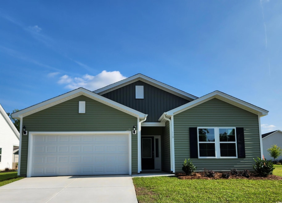 View of front facade featuring driveway, an attached garage, a front yard, and board and batten siding