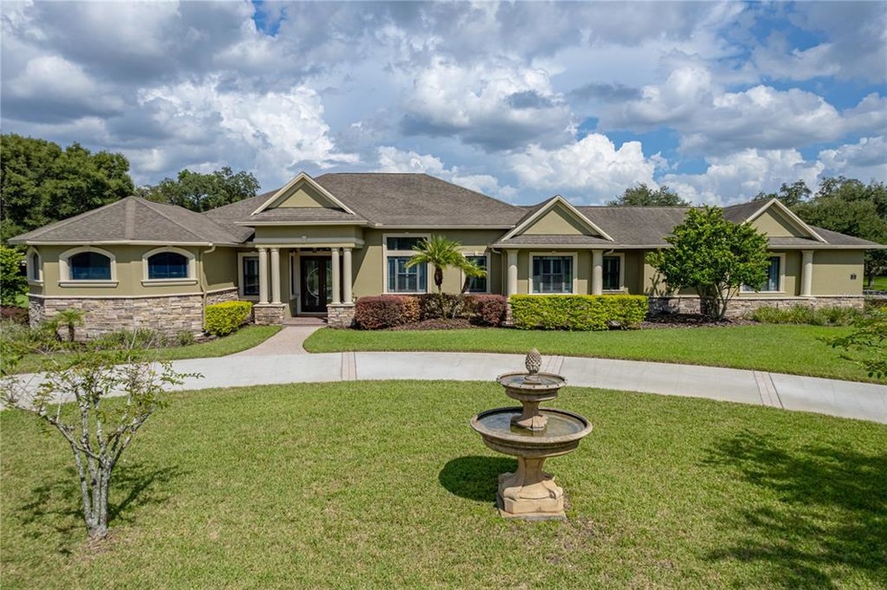 Exterior Front with Circular Drive and Fountain