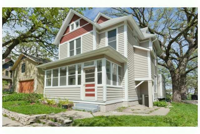 Exterior Front. New siding and gutters.