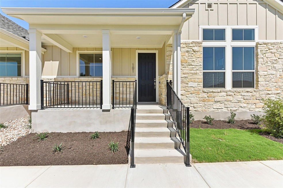 Doorway to property with a porch, board and batte