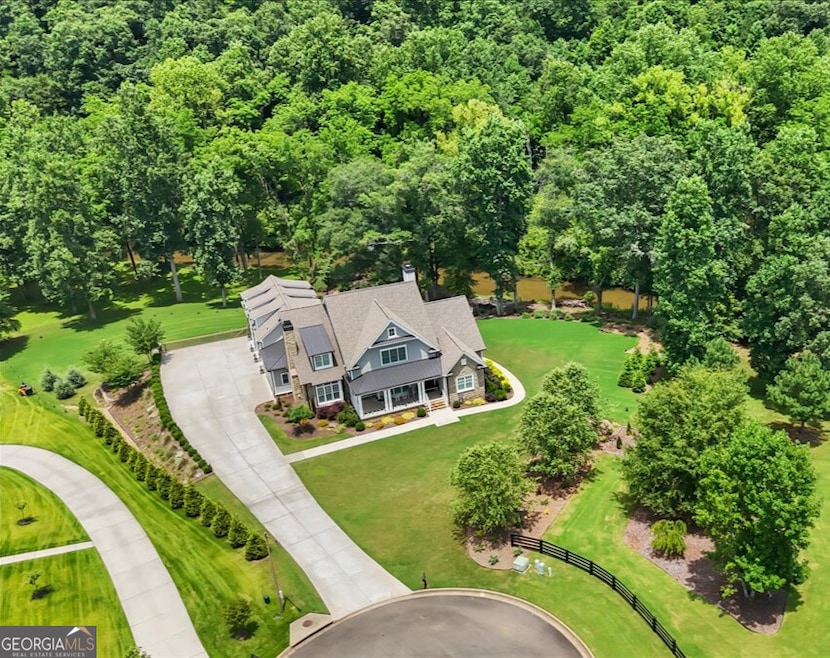 Welcome home to 134 Sharp Mountain!This is more than an address-it's an exclusiveparadise nestled on two private, park-like acres withstunning, accessible frontage on the
