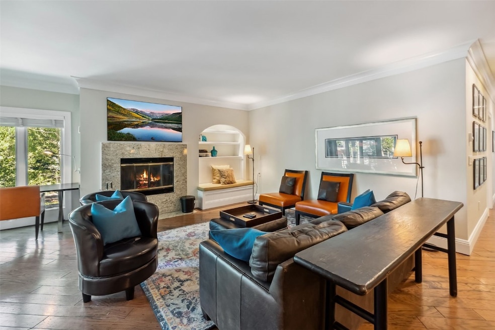 Living room featuring crown molding, a premium fir