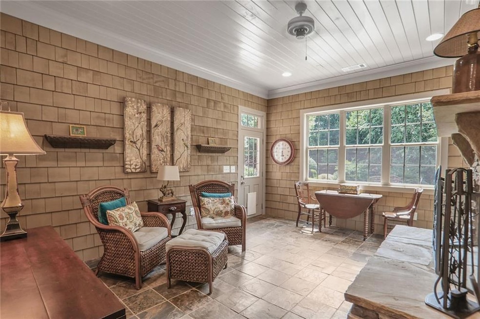 Rear Sunroom featuring ornamental molding